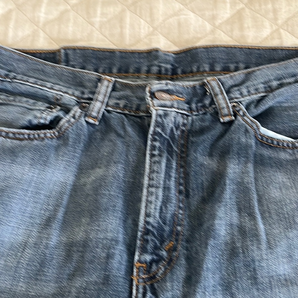 Levi’s 514 distressed indigo jeans